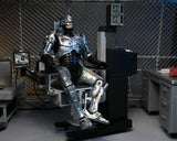 NECA - Robocop - Ultimate Battle-Damaged RoboCop with Chair